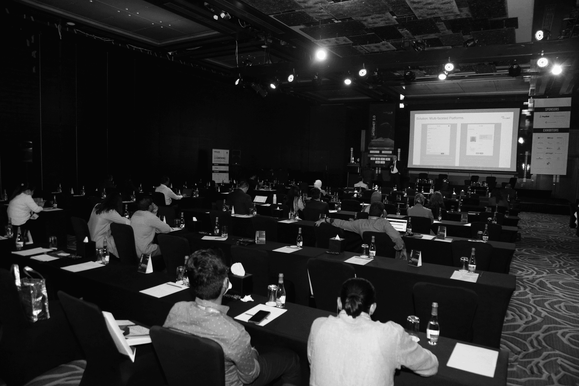 Tech conference audience viewing a presentation